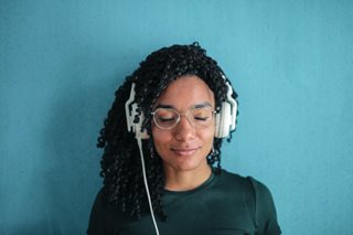 black woman with headphones