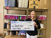 woman holding large check