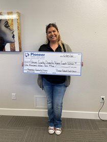 woman with a large check