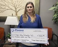 woman holding a check