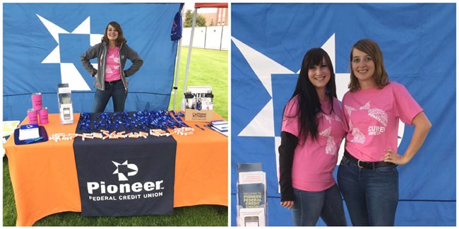 Two female Pioneer employees running a booth at a BSU game