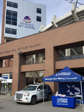 Blue Pioneer booth set up in front of BSU stadium