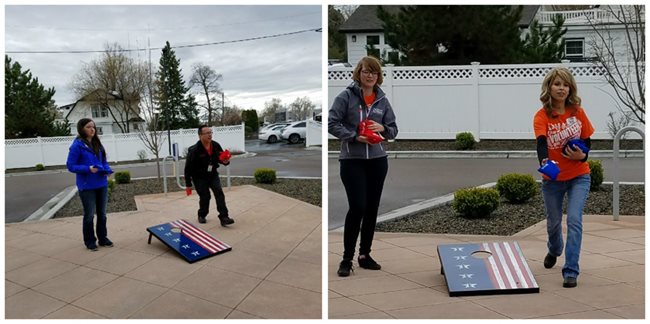 Pioneer employees playing corn hole
