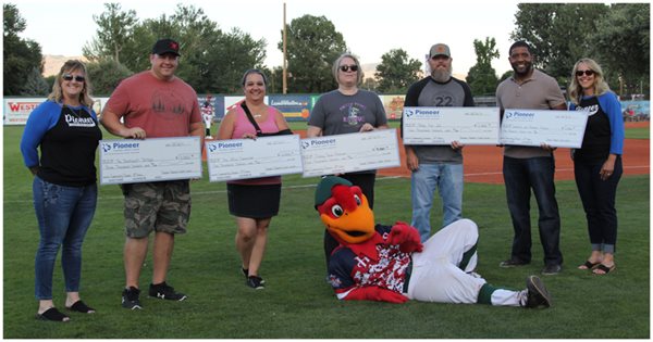 Community Pioneer winners with their checks and the Boise Hawks mascot