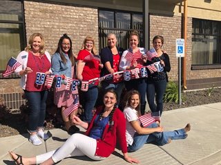 Pioneer employees all wearing red, white and blue clothes