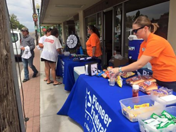 Pioneer employees hosting a community event outside their branch