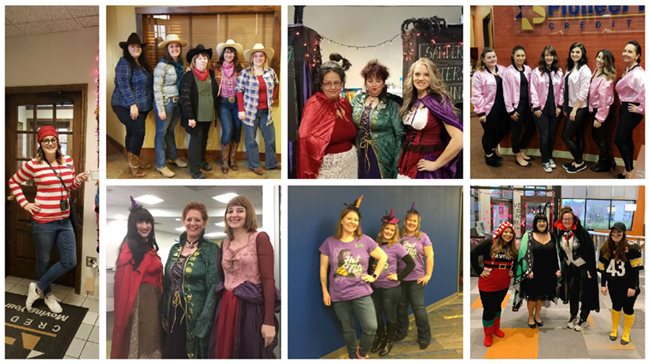 Pioneer employees all wearing different costumes for Halloween including witches, Waldo, cowboys