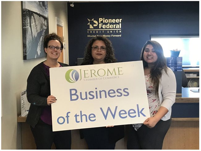Three Pioneer employees holding a sign for being Jerome's Business of the Week