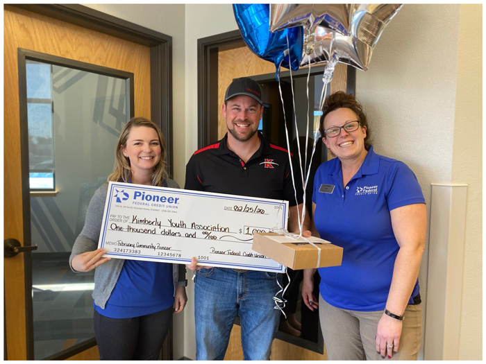 Two Pioneer employees with a Community Pioneer winner