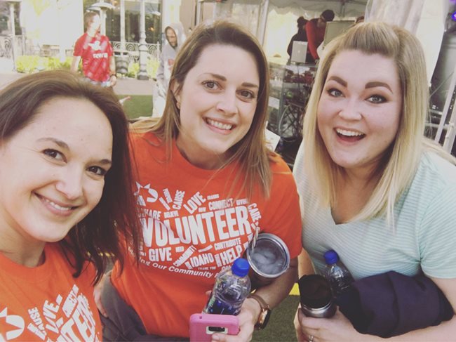 Three smiling women after working out on exercise bikes