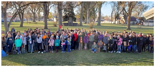 Pioneer volunteers raking up leaves