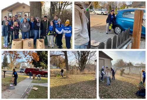 Pioneer volunteers raking up leaves