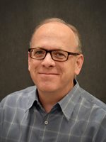 Older gentleman with black square classes