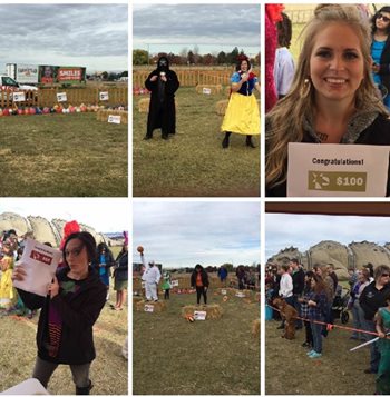 People in an open field winning cash prizes and playing games