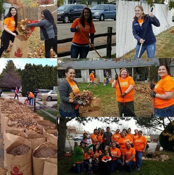 Pioneer employees in orange shirts raking up leaves