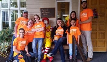 Pioneer volunteers in orange shirts at the Ronald McDonald House
