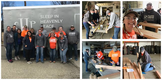 group of Pioneer volunteers building bunk beds for charity