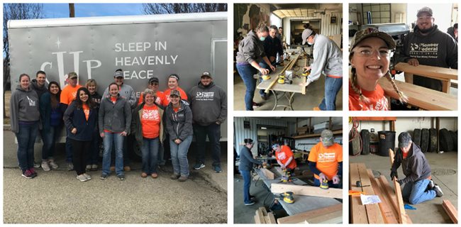 group of Pioneer volunteers building bunk beds for charity