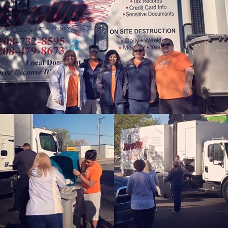 Pioneer employees in front of a paper shredder truck