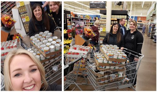 Pioneer volunteers with grocery carts full of food