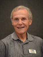 Elderly gentleman with silver hair and a big smile
