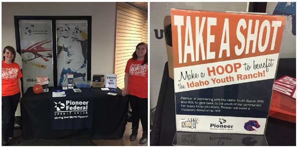 Pioneer employees running a booth with a basketball hoop game