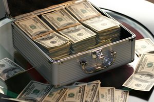 stacks of 100 dollar bills in a metal briefcase