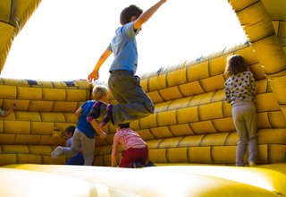 kids bouncing in a bouncy castle