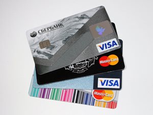 four credit cards stack on top of each other