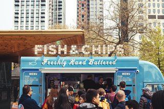 food truck with a long line of people