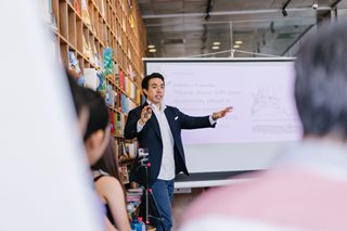 man running a presentation to a group of people