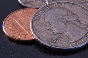 A US quarter and penny