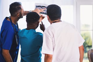 doctors looking at an xray