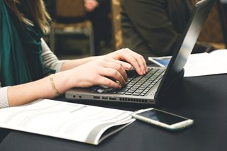 young woman working on a laptop