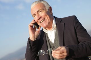 mature man on a phone