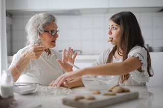 grandma and daughter talking while eating cookies