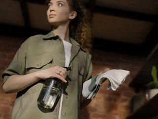 woman with cleaning supplies