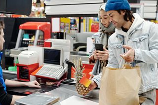 man and woman buying groceries