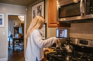 woman cooking at stove