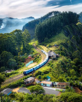 train going through a mountain path