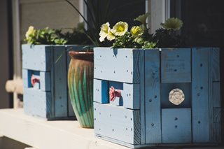two pots made out of recycled woods