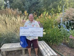 man with a large check