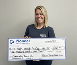woman holding large check