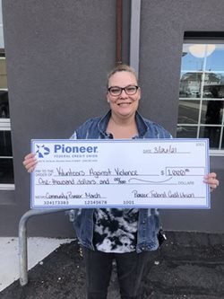 woman holding large check