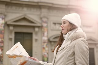 woman walking with map