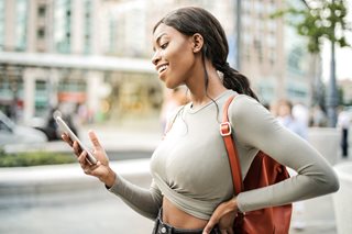woman looking at her smartphone