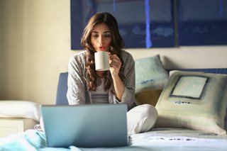 woman with coffee mug and laptop