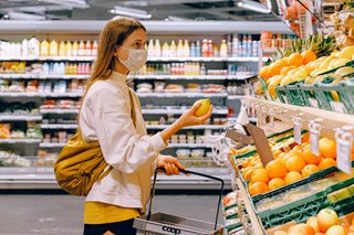woman holding a lemon