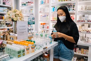 woman wearing a mask shopping