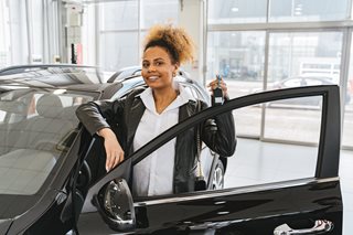 woman with car keys and new car